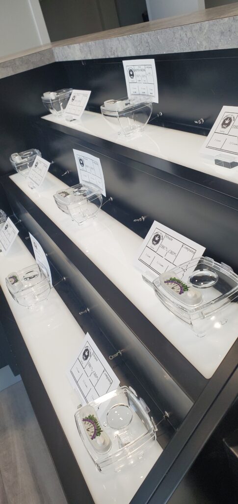 Glass items arranged on three shelves